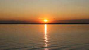 stock-footage-sunset-on-a-ocean-shore